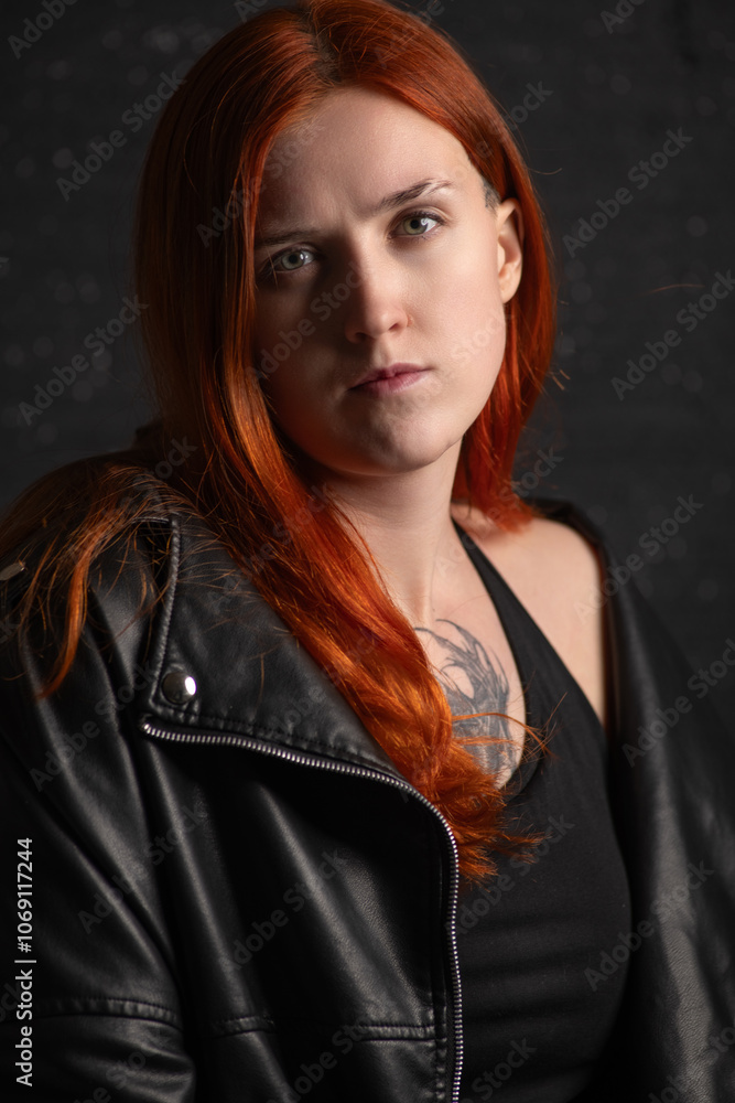 Studio portrait of a young beautiful red-haired girl. Studio portrait of a young beautiful red-haired girl.