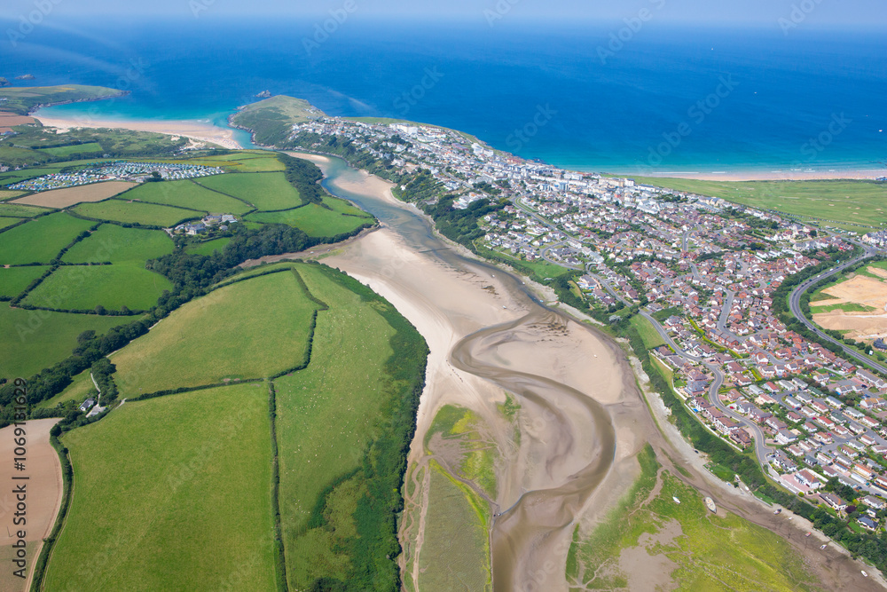 Aerial view of the coastal town of Newquay and surf mecca of Fistral beach with Gannel river