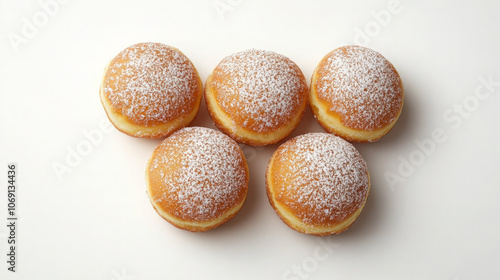 Five powdered sugar doughnuts arranged in a circular pattern on a white background.