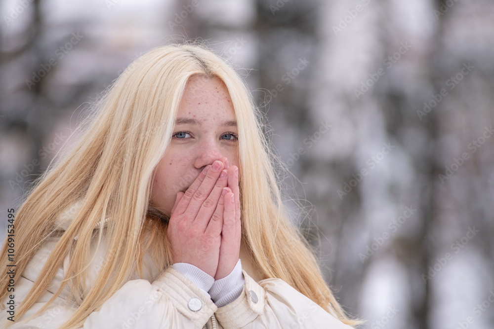 Portrait of young beautiful blonde girl outdoors in winter. Portrait of young beautiful blonde girl outdoors in winter.
