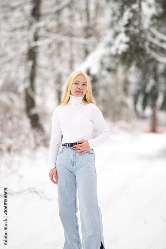 Portrait of young beautiful blonde girl outdoors in winter. Portrait of young beautiful blonde girl outdoors in winter.