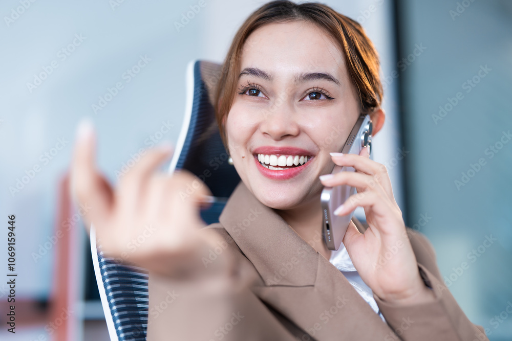 Confident businesswoman smiling while talking on the phone, radiating positivity and professionalism Confident businesswoman smiling while talking on the phone, radiating positivity and professionalism