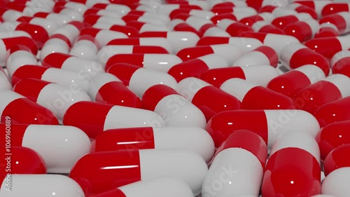 Overhead Dolly Shot of Colorful Capsules in Motion