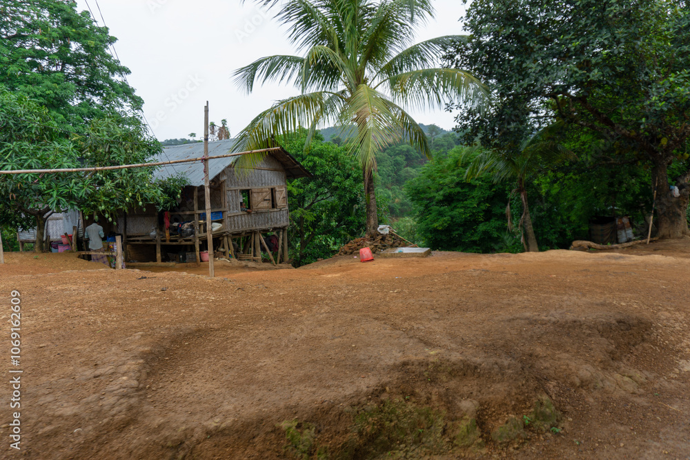 Adivasi homesteads on either side of the Bandarban hilly road. Tribal accommodation. Bandarban hill region is a tourist spot in Bangladesh. Adivasi homesteads on either side of the Bandarban hilly road. Tribal accommodation. Bandarban hill region is a tourist spot in Bangladesh.