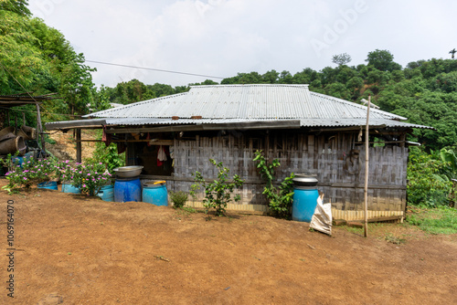 Adivasi homesteads on either side of the Bandarban hilly road. Tribal accommodation. Bandarban hill region is a tourist spot in Bangladesh. photo