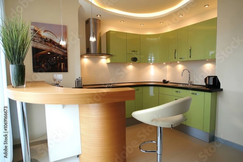 Modern Kitchen with Curved Bar Counter and Green Cabinets photo