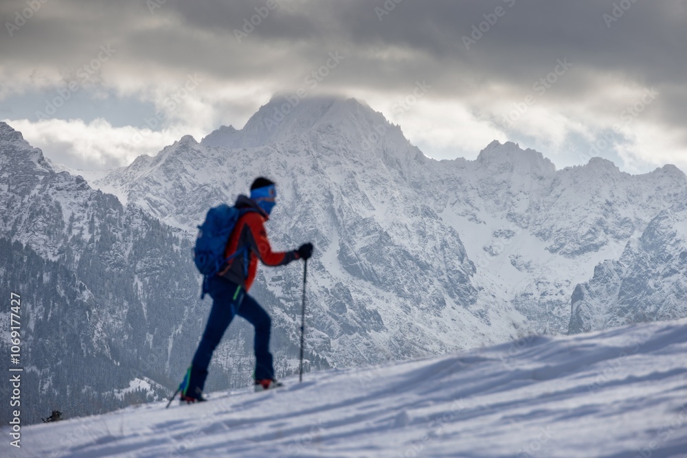 Tourist walking in high mountains in winter. Tourist walking in high mountains in winter.