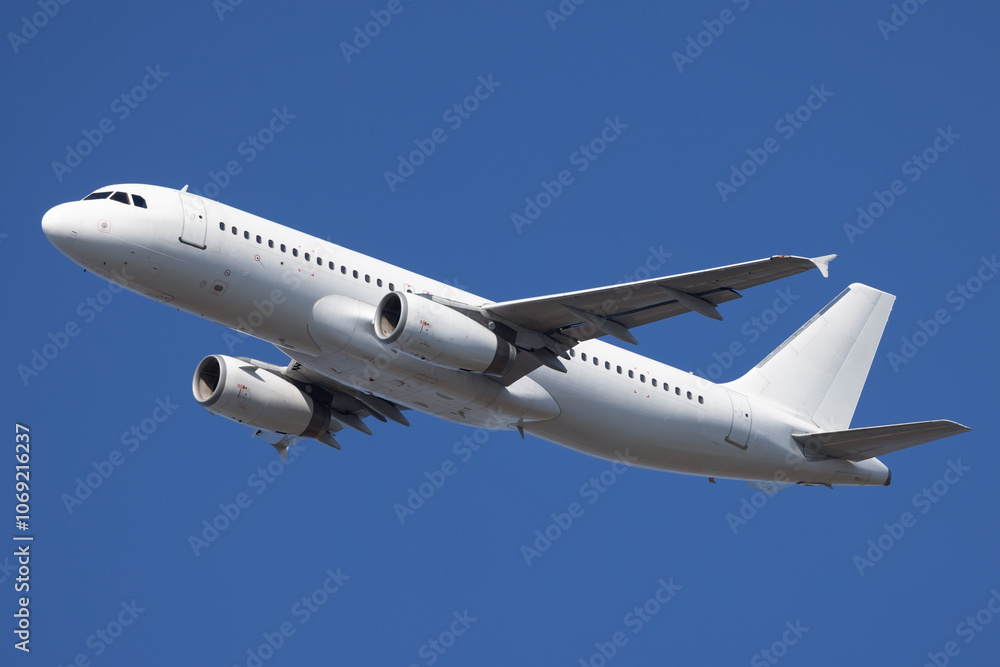Fototapeta premium White airplane departing airport.