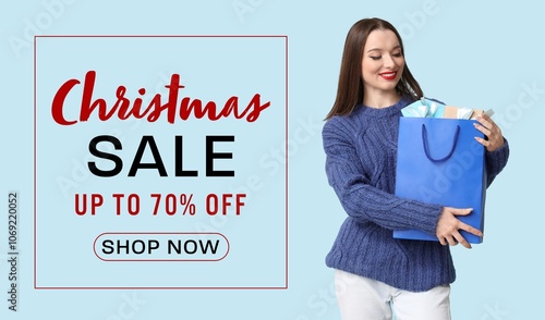 Beautiful young woman holdi...