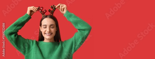 Young woman in sweater and ...