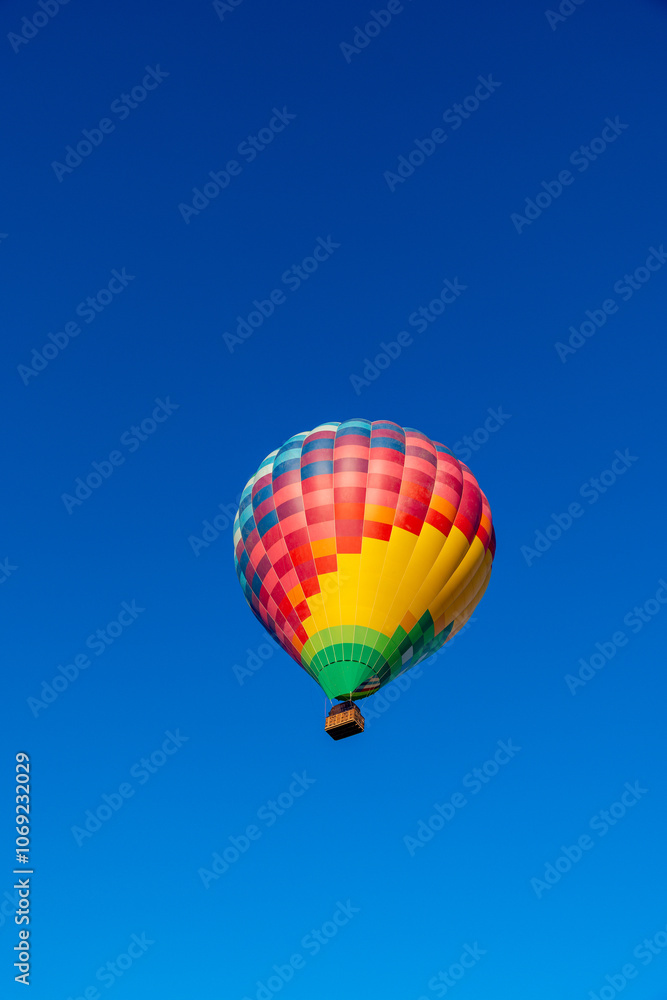 Kubicek Balloon Floating in Clear Blue Sky Kubicek Balloon Floating in Clear Blue Sky