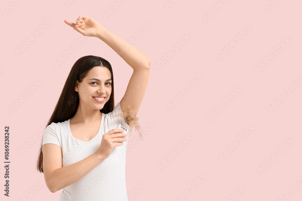 Beautiful young happy woman with dry common reeds and modern epilator on pink background. Depilation concept Beautiful young happy woman with dry common reeds and modern epilator on pink background. Depilation concept