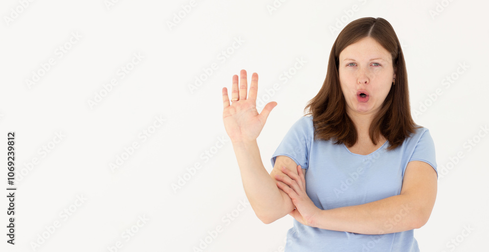 Portrait of young woman making stop sign in front of the camera. Portrait of young woman making stop sign in front of the camera.