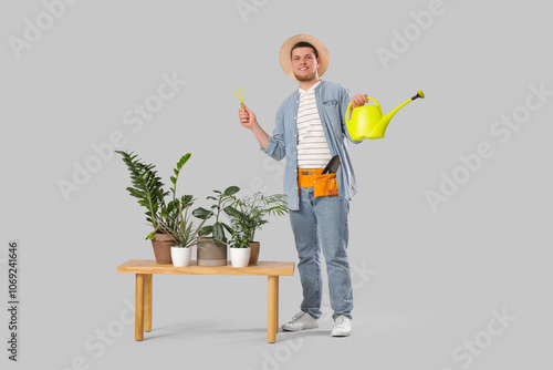 Young male gardener with ga...