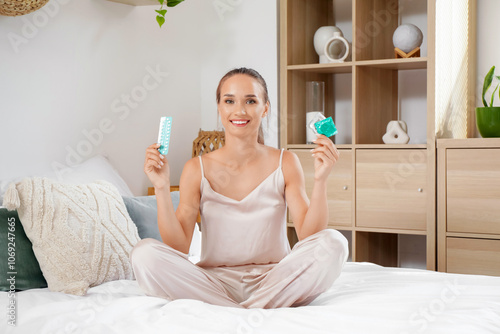 Young woman with condoms an...