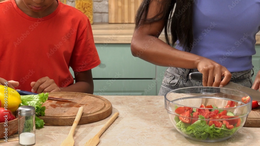 African American happy family preparing food in the kitchen. African American happy family preparing food in the kitchen.