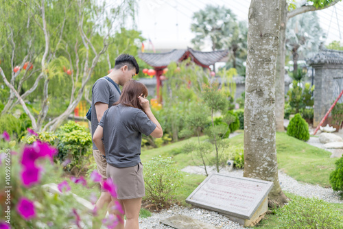Canvas Print Chinese Malaysian couple in their 30s spending time in Chinese-style garden in Kuala Lumpur, Malaysia