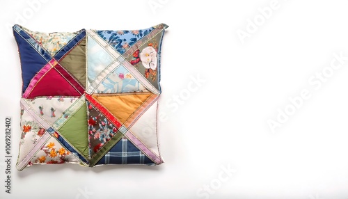 Pillow made of Patch or pieced work is a form of needlework that involves sewing together pieces of fabric into a larger design based on repeating patterns built up with different fabric shapes photo