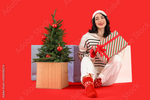 Pretty young woman in Santa...