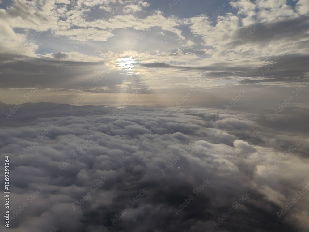 Naklejka premium Sunrise clouds from airplane