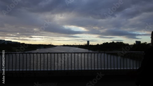 View south from Reichsbrucke to Neue Donau - timelapse of sunset in Vienna, the capital of Austria photo