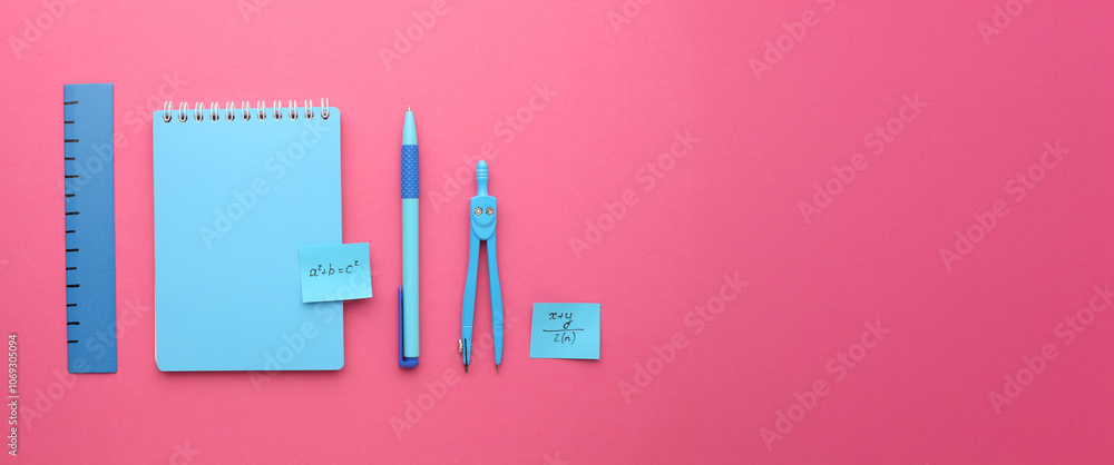 Stationery calculator ruler calculator and school cheat sheets on coloured background. Concept of school and college learning Stationery calculator ruler calculator and school cheat sheets on coloured background. Concept of school and college learning