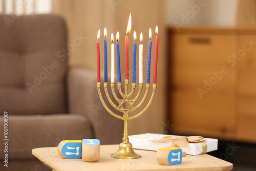 Hanukkah menorah with lit c...