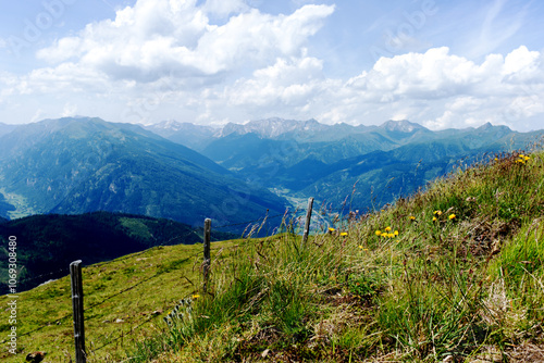 Austrian alps with a fence - view from the top of the mountain