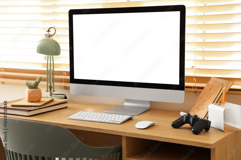 Modern workplace with blank computer monitor in living room Modern workplace with blank computer monitor in living room