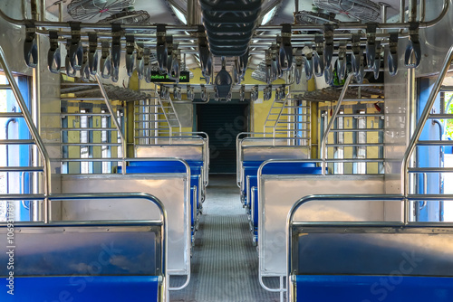 View inside the empty coach of local passenger train, general class (2nd sitting) at Pernem railway station. Pernem, Goa, India.