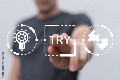 Man using virtual touch screen presses word: TRY. Try it now or try again business slogan concept. Try it free.