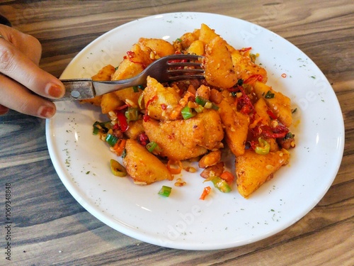 crispy Tahu Cabe Garam (chili salt tofu). Spicy fried tofu sprinkled with dried red and green chilies