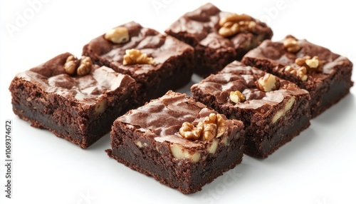 Delicious homemade brownies with walnuts on a white platter in natural lighting