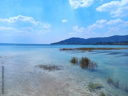 Clear waters and scenic landscape of Lake Peten Itza in El Remate, Peten, Guatemala photo