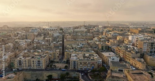 Wallpaper Mural Enchanting Aerial View of Valletta Malta at Sunset Revealing the Urban Landscape with Beautiful Architecture of Historic Cathedrals and Buildings. High quality 4k footage Torontodigital.ca
