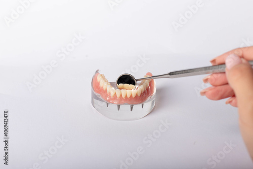 render of mandibular prosthesis all on 4 system supported by implants over white background