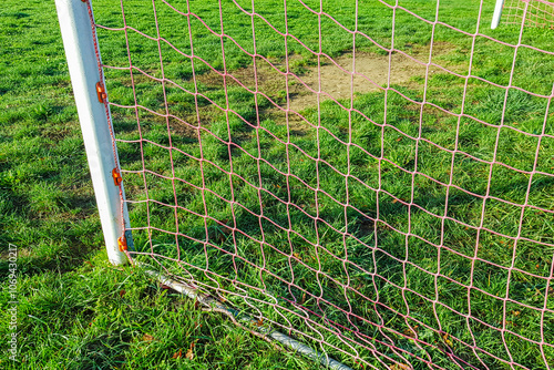 old soccer goal post on green grass