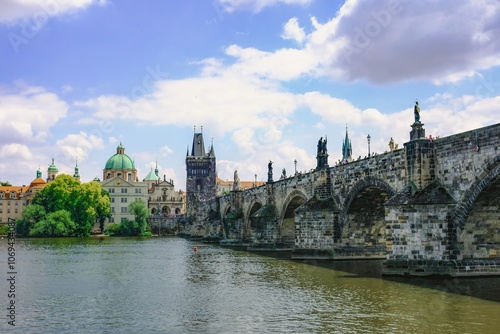 Prague, the capital city of Czechia - A picturesque view of a famous Charles bridge spanning a river Vltava, capturing the essence of architectural beauty.