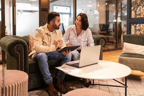 Collaboration and brainstorming in a modern coworking space photo