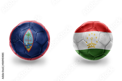 football balls with national flags of tajikistan and guam ,soccer teams. on the white background. photo