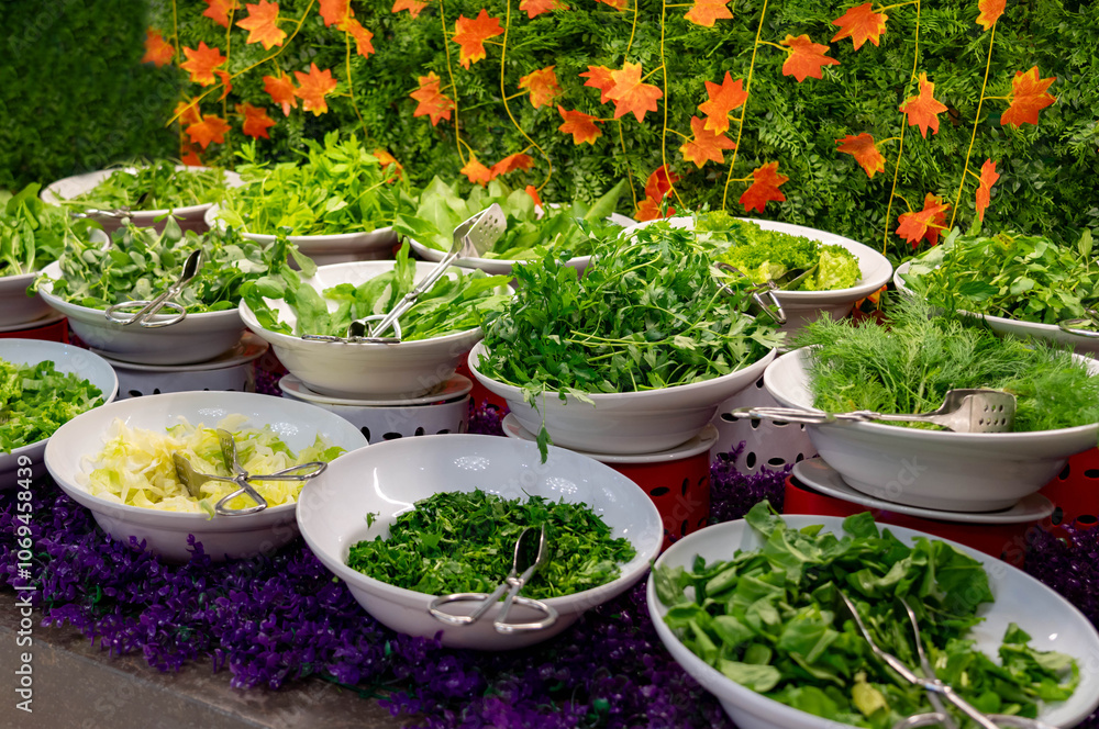 A buffet in a nice hotel with a variety of greens and edible leaves A buffet in a nice hotel with a variety of greens and edible leaves