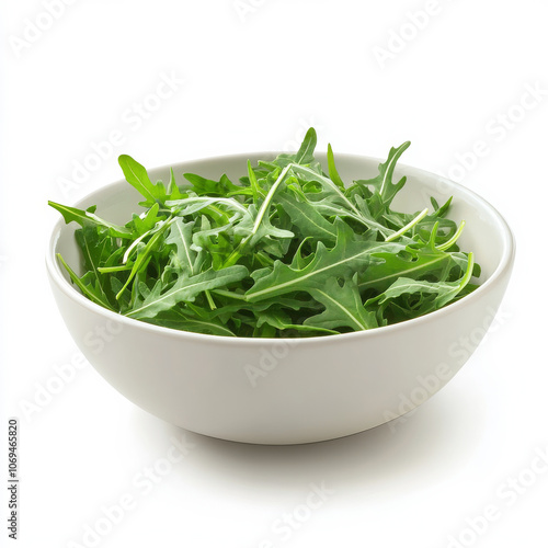 A bowl of fresh arugula, isolated on a white background, emphasizing a peppery green