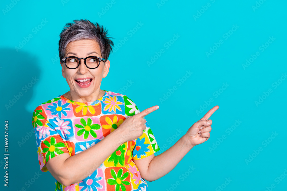 Portrait of nice aged lady direct fingers empty space wear t-shirt isolated on turquoise color background