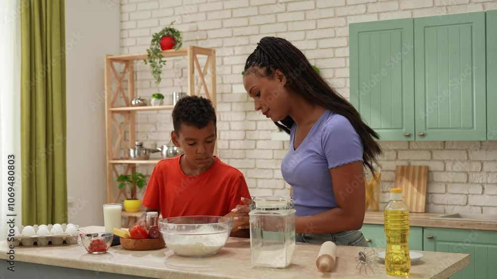 African American happy family preparing food in the kitchen. African American happy family preparing food in the kitchen.