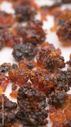 angle view herb CuMoYao or Myrrha or Myrrh Stir-frying with Vinegar rotating at vertical