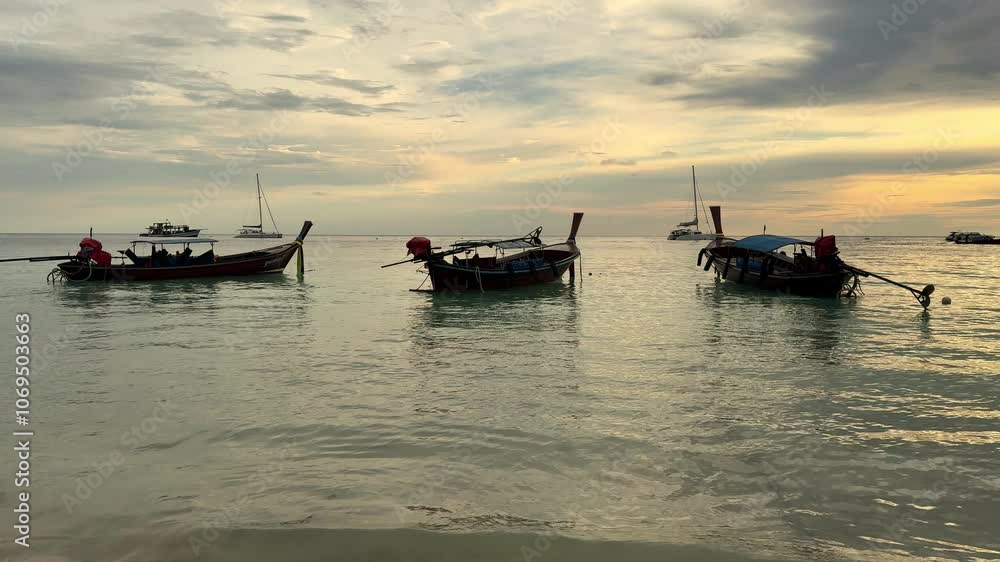 Small fishing boats are parked on the beach. Small fishing boats are parked on the beach.