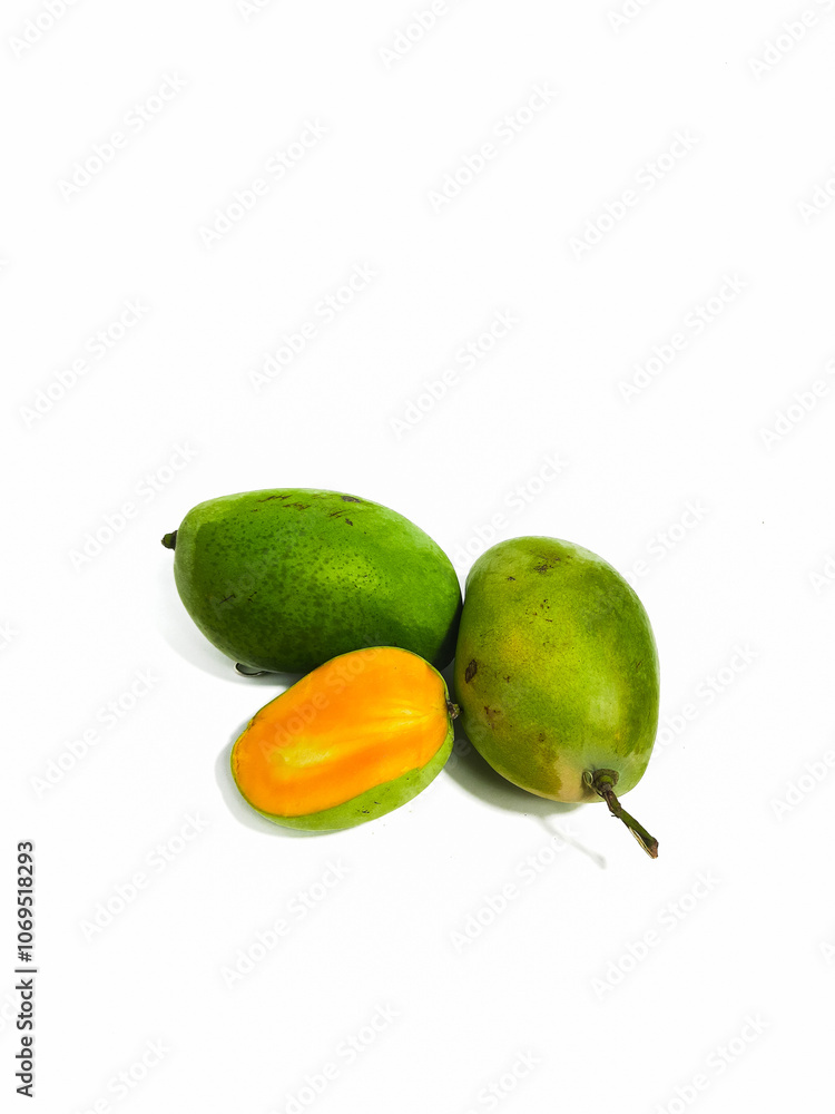 Fresh green mango with cut in half on isolated white background Fresh green mango with cut in half on isolated white background