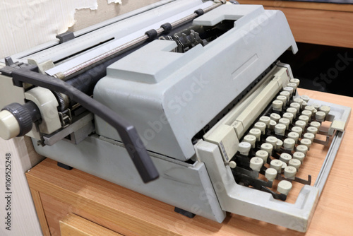 Photo of an old and antique typewriter on an office desk