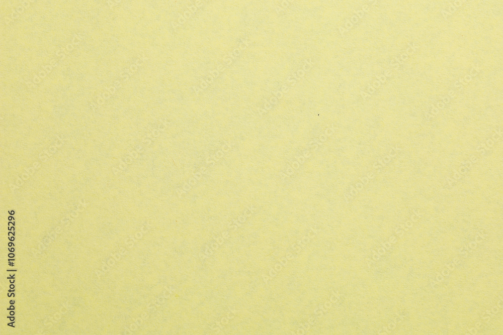 Fototapeta premium A yellow background with a white object in the middle, textured origami paper backdrop