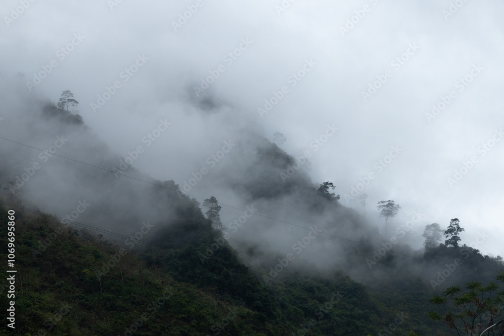 Ha Giang, Vietnam January 9, 2024: White clouds cover the mountains rocky Global Geopark in Ha Giang, Vietnam Ha Giang, Vietnam January 9, 2024: White clouds cover the mountains rocky Global Geopark in Ha Giang, Vietnam